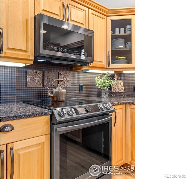 658 Cedar Ridge Cir, Estes Park, CO 80517 - kitchen featuring appliances with stainless steel finishes, glass insert cabinets, tasteful backsplash, and light brown cabinets