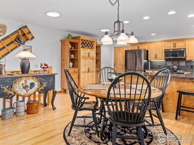 658 Cedar Ridge Cir, Estes Park, CO 80517 - dining area with light wood-style flooring, recessed lighting, and a chandelier