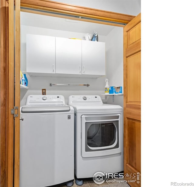 658 Cedar Ridge Cir, Estes Park, CO 80517 - laundry area with cabinet space and washer and dryer