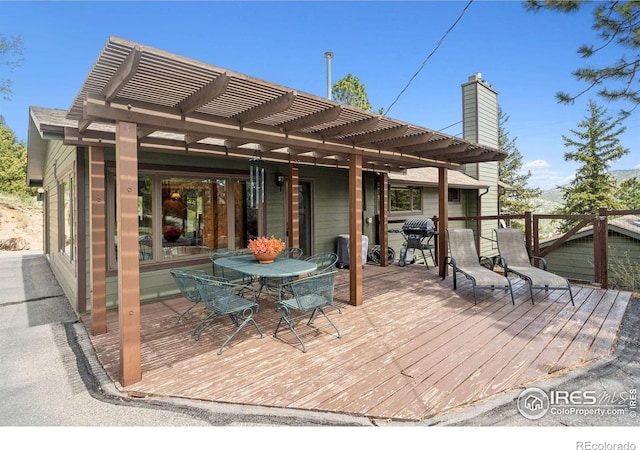 1433 Vista View Ln, Estes Park, CO 80517 - wooden terrace featuring a pergola and outdoor dining area