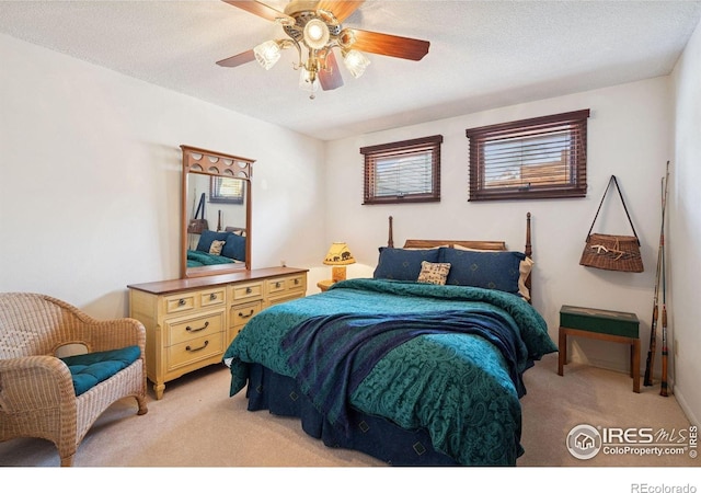 1433 Vista View Ln, Estes Park, CO 80517 - bedroom featuring light colored carpet, ceiling fan, and a textured ceiling
