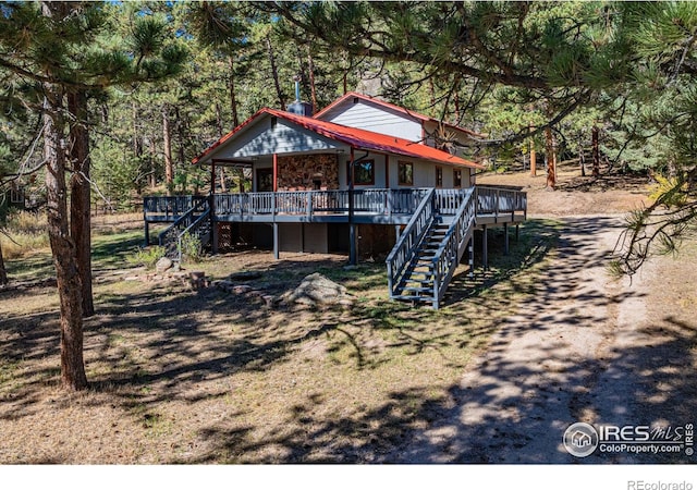 31 Cedar Dr, Lyons, CO 80540 - view of front of home featuring stairs and a deck