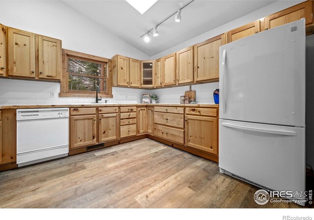 31 Cedar Dr, Lyons, CO 80540 - kitchen featuring white appliances, a sink, lofted ceiling, light countertops, and light wood-type flooring