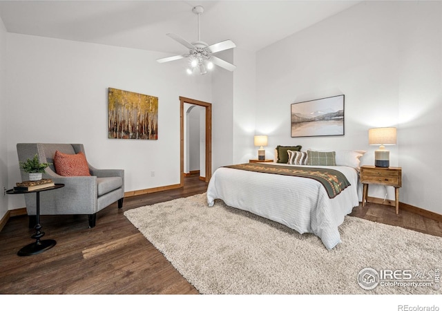 31 Cedar Dr, Lyons, CO 80540 - bedroom with wood finished floors, baseboards, vaulted ceiling, and a ceiling fan