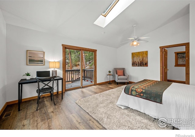 31 Cedar Dr, Lyons, CO 80540 - bedroom with access to outside, a skylight, wood finished floors, baseboards, and a ceiling fan