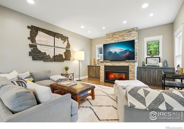 3059 6th St, Boulder, CO 80304 - living room featuring recessed lighting, wood finished floors, a fireplace, and baseboards