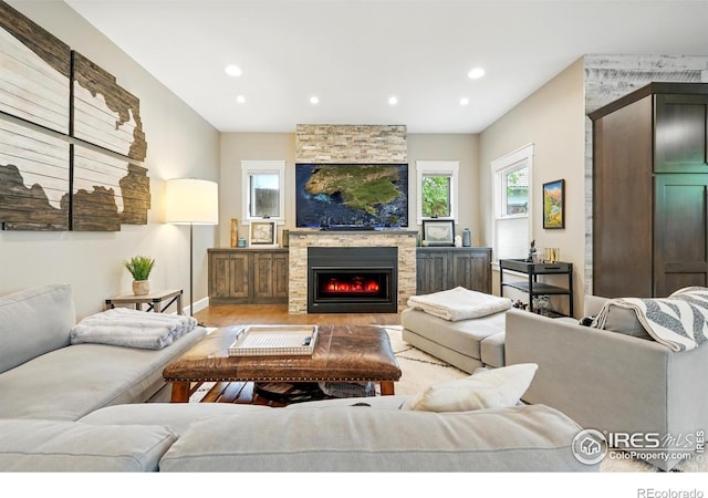 3059 6th St, Boulder, CO 80304 - living room featuring light wood-type flooring, a stone fireplace, recessed lighting, and baseboards