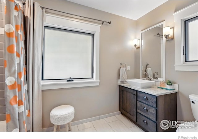 3059 6th St, Boulder, CO 80304 - full bathroom with toilet, vanity, tile patterned floors, a shower with shower curtain, and baseboards