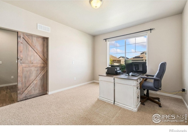 home office with baseboards and carpet