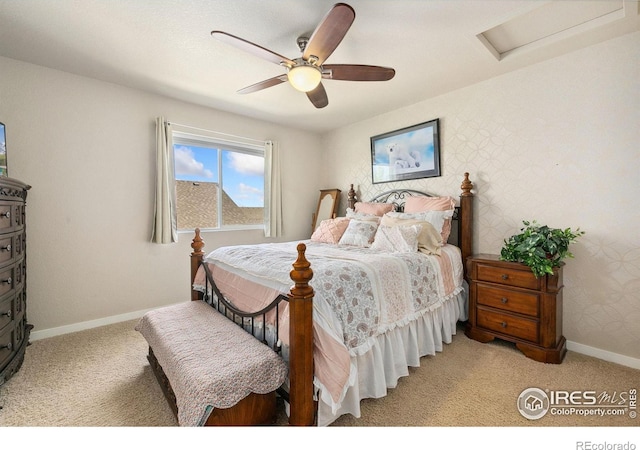 bedroom with attic access, light carpet, baseboards, ceiling fan, and wallpapered walls