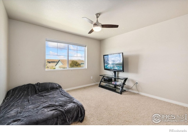 carpeted bedroom with baseboards and ceiling fan