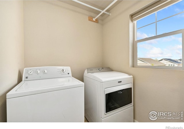 washroom with washer and dryer