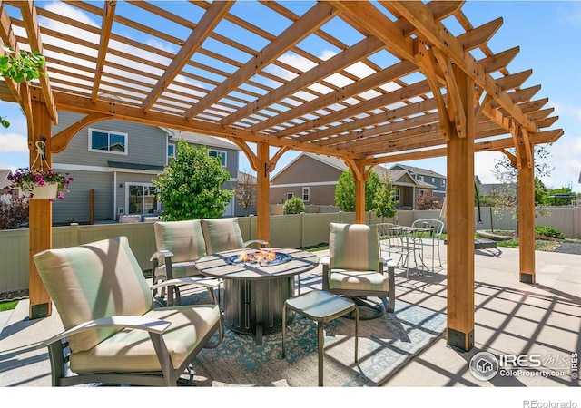 view of patio featuring an outdoor fire pit, a pergola, and outdoor dining space
