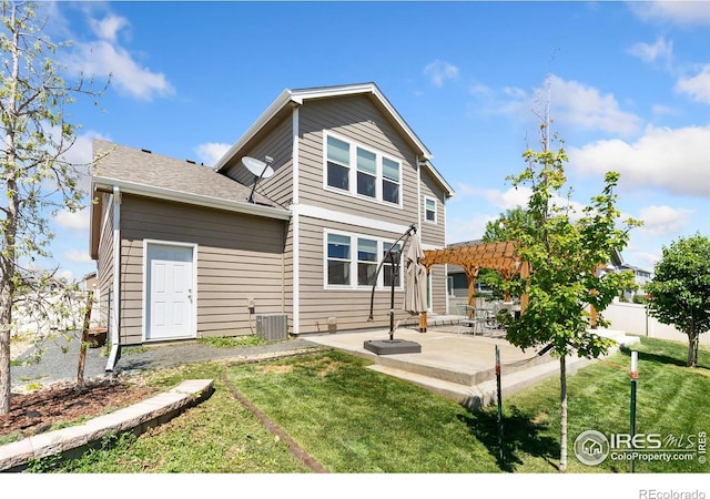 back of property with a pergola, a patio, and central AC unit