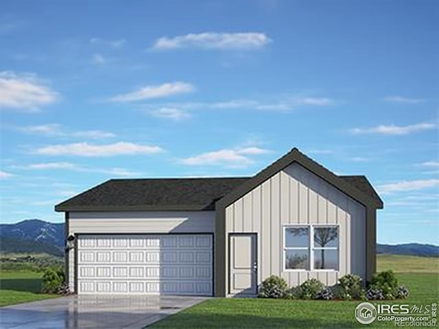 7167 Gateway Crossing St, Wellington, CO 80549 - view of front of home with a front yard, board and batten siding, concrete driveway, and a mountain view