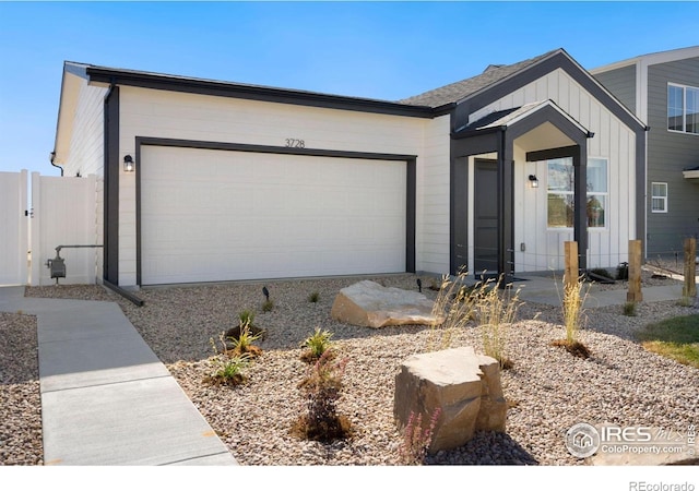 7167 Gateway Crossing St, Wellington, CO 80549 - view of front facade featuring board and batten siding and an attached garage