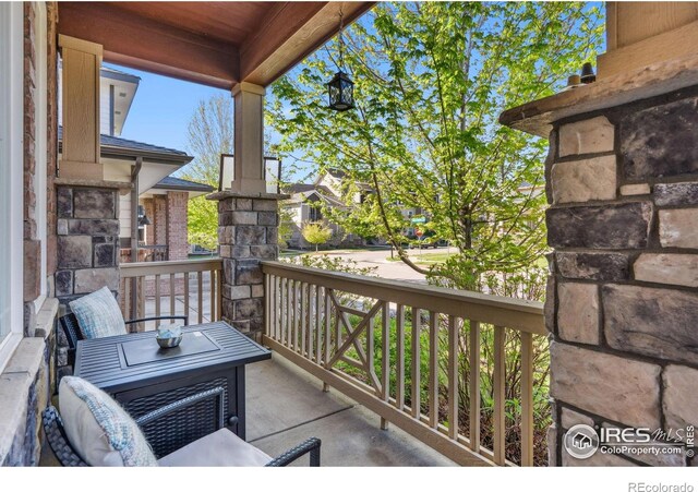 2150 Blue Yonder Way, Fort Collins, CO 80525 - balcony featuring covered porch