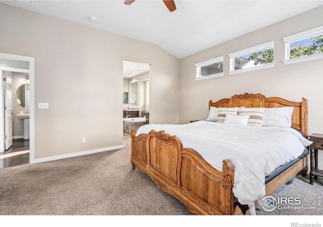 2150 Blue Yonder Way, Fort Collins, CO 80525 - bedroom with baseboards, ensuite bathroom, lofted ceiling, carpet floors, and multiple windows