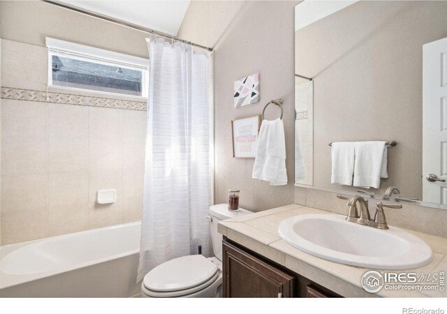2150 Blue Yonder Way, Fort Collins, CO 80525 - bathroom featuring toilet, vanity, and shower / tub combo with curtain