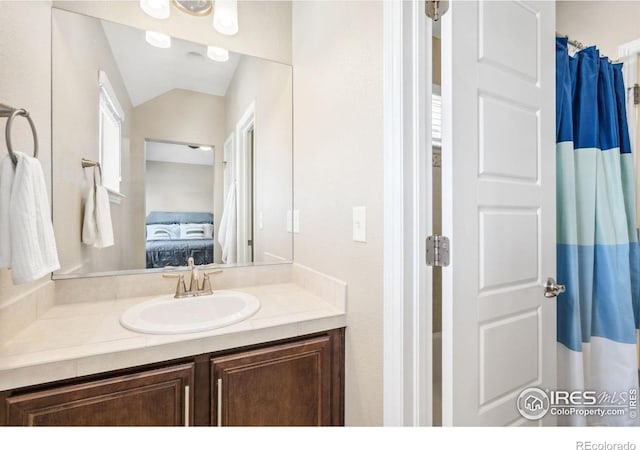 2150 Blue Yonder Way, Fort Collins, CO 80525 - ensuite bathroom featuring vanity and lofted ceiling