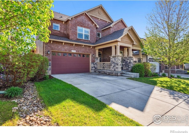 2150 Blue Yonder Way, Fort Collins, CO 80525 - craftsman-style home featuring covered porch, a garage, driveway, a front lawn, and stone siding