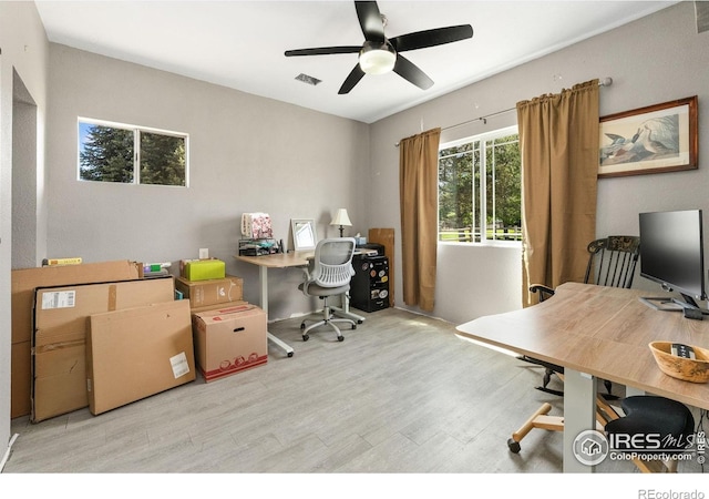 office with wood finished floors and a ceiling fan