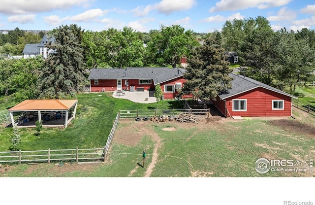 view from above of property with a tree filled landscape