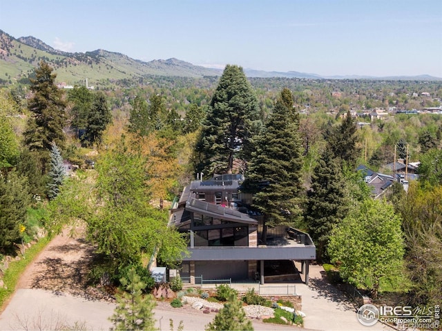 505 Geneva Ave, Boulder, CO 80302 - view of subject property featuring a heavily wooded area and a mountainous background