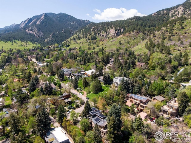 505 Geneva Ave, Boulder, CO 80302 - aerial overview of property's location featuring a mountain backdrop and a heavily wooded area