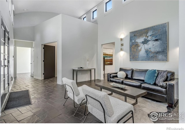 505 Geneva Ave, Boulder, CO 80302 - living area featuring high vaulted ceiling, french doors, and baseboards
