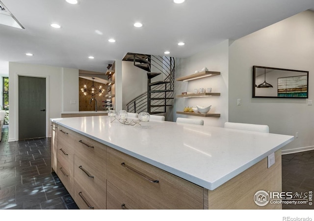 505 Geneva Ave, Boulder, CO 80302 - kitchen featuring light brown cabinets, recessed lighting, stone tile floors, modern cabinets, and light countertops