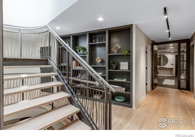 505 Geneva Ave, Boulder, CO 80302 - stairs featuring wood finished floors, rail lighting, baseboards, and recessed lighting