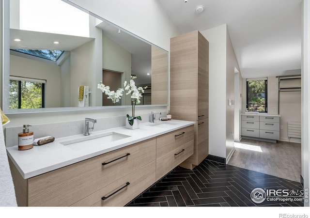 505 Geneva Ave, Boulder, CO 80302 - bathroom featuring healthy amount of natural light, double vanity, a skylight, and recessed lighting