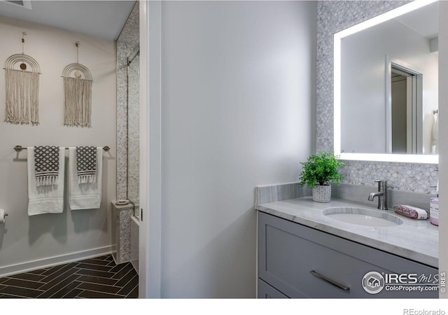 505 Geneva Ave, Boulder, CO 80302 - full bathroom featuring brick patterned flooring, vanity, and baseboards