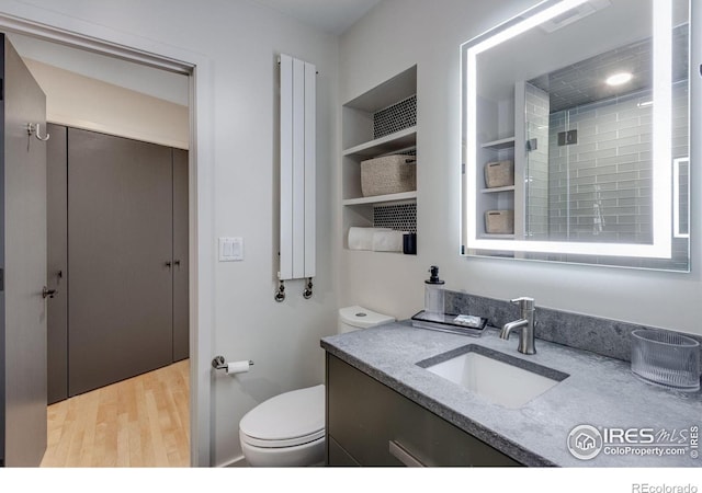 505 Geneva Ave, Boulder, CO 80302 - bathroom with wood finished floors, vanity, and toilet