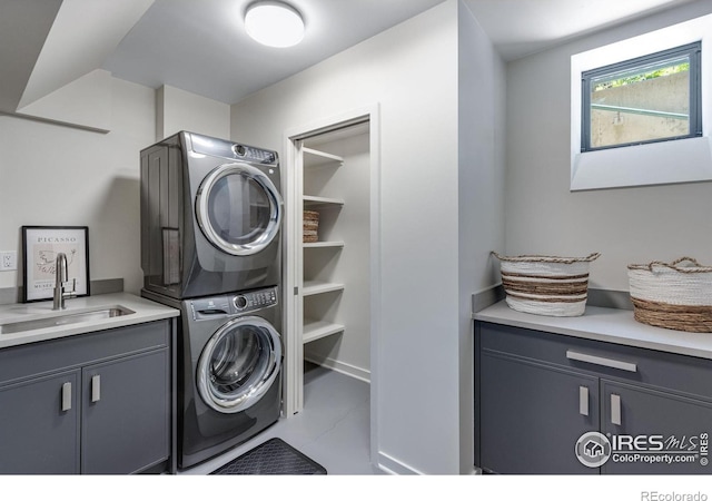 505 Geneva Ave, Boulder, CO 80302 - laundry room with stacked washer / drying machine, cabinet space, and tile patterned floors