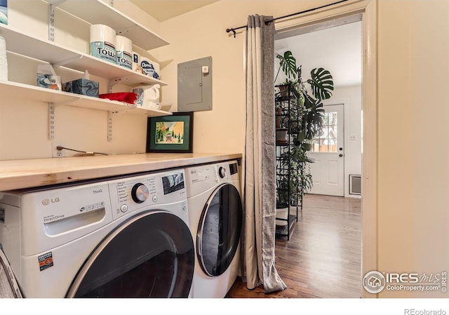 1136 Venice St, Longmont, CO 80501 - clothes washing area with washing machine and dryer, wood finished floors, and electric panel