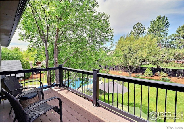 wooden terrace featuring view of scattered trees