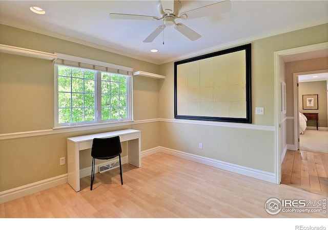 unfurnished office with wood finished floors, a ceiling fan, recessed lighting, and baseboards