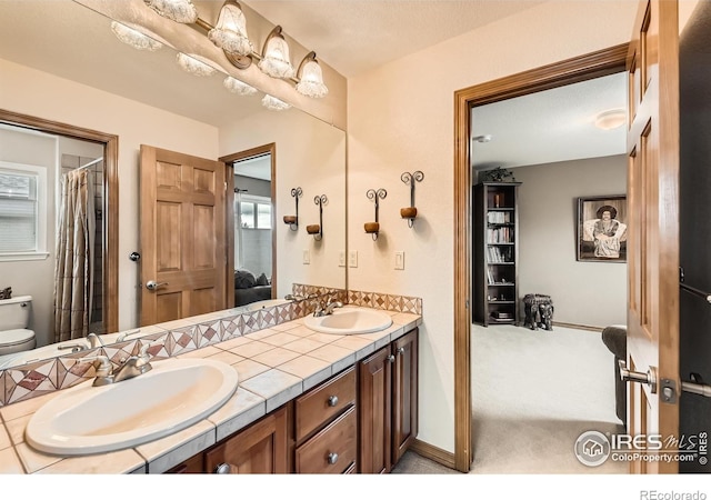 14180 Whitney Cir, Broomfield, CO 80023 - full bathroom featuring double vanity and toilet