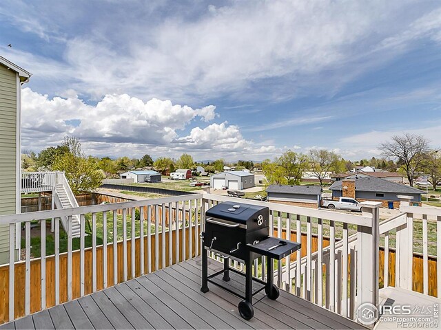 wooden deck with a residential view