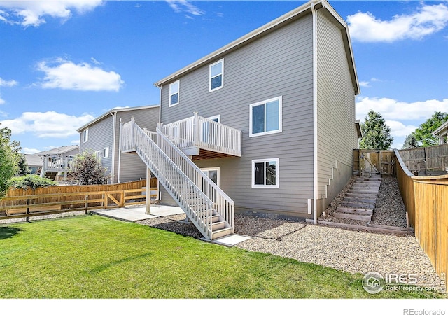 920 Wagon Bend Rd, Berthoud, CO 80513 - back of house with stairs, a fenced backyard, and a deck