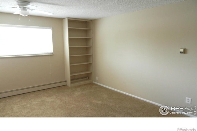 4150 Monroe Dr Unit C, Boulder, CO 80303 - carpeted empty room featuring a textured ceiling, a ceiling fan, a baseboard heating unit, and baseboards