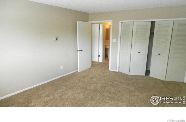 4150 Monroe Dr Unit C, Boulder, CO 80303 - unfurnished bedroom featuring carpet, a closet, and baseboards