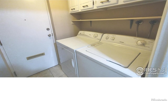 4150 Monroe Dr Unit C, Boulder, CO 80303 - laundry area with cabinet space, washing machine and dryer, and light tile patterned flooring