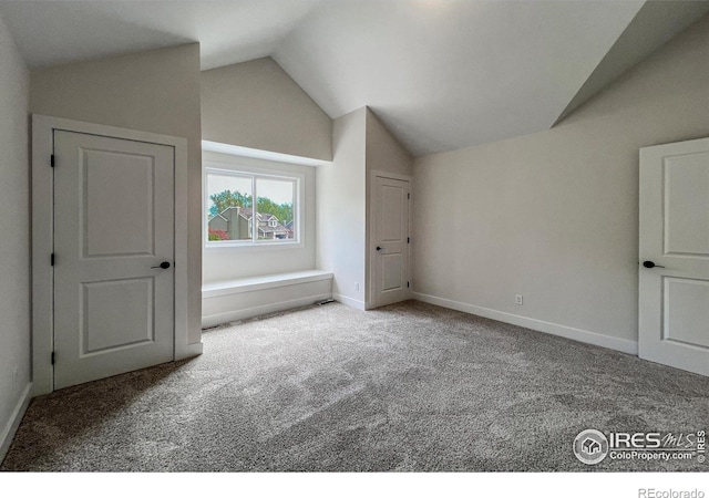 5978 Scotswood Ct, Boulder, CO 80301 - additional living space featuring vaulted ceiling, carpet floors, and baseboards
