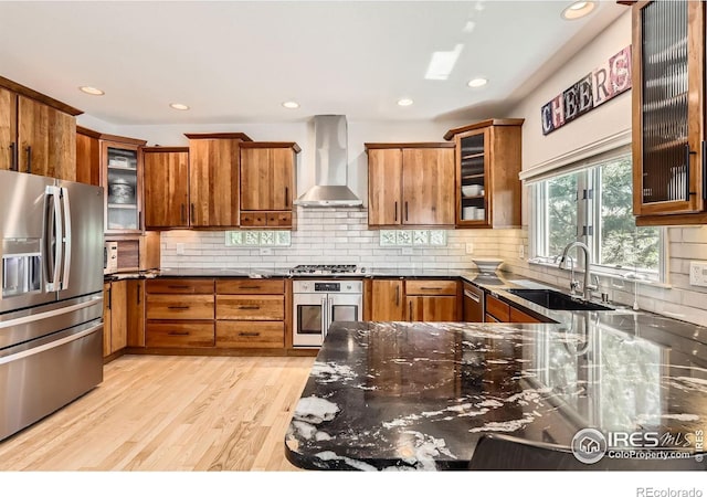 933 Xenon Ct, Golden, CO 80401 - kitchen with appliances with stainless steel finishes, wall chimney exhaust hood, a sink, brown cabinets, and recessed lighting