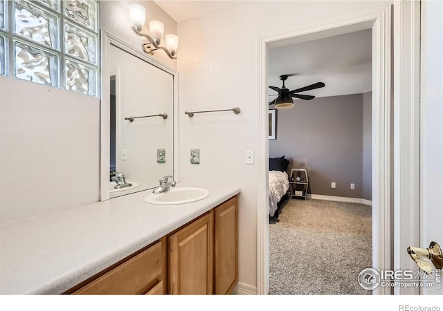 933 Xenon Ct, Golden, CO 80401 - ensuite bathroom with ceiling fan and vanity
