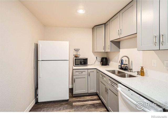933 Xenon Ct, Golden, CO 80401 - kitchen with white appliances, a sink, gray cabinets, dark wood-style flooring, and baseboards