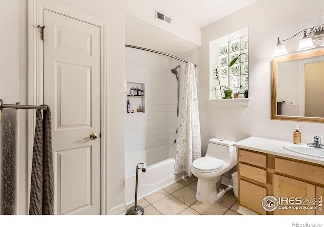 933 Xenon Ct, Golden, CO 80401 - full bath featuring toilet, tile patterned floors, vanity, and shower / bath combo with shower curtain